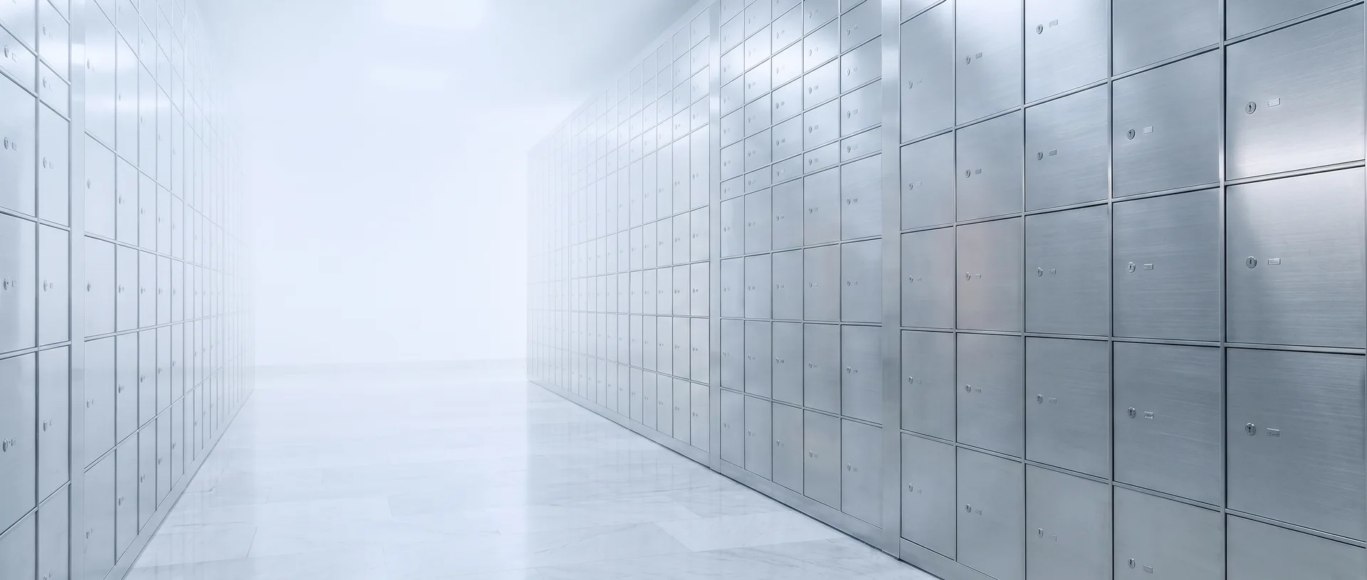 Halocard virtual card vault: a corridor of brushed-steel safe-deposit boxes, symbolising private, secure card storage